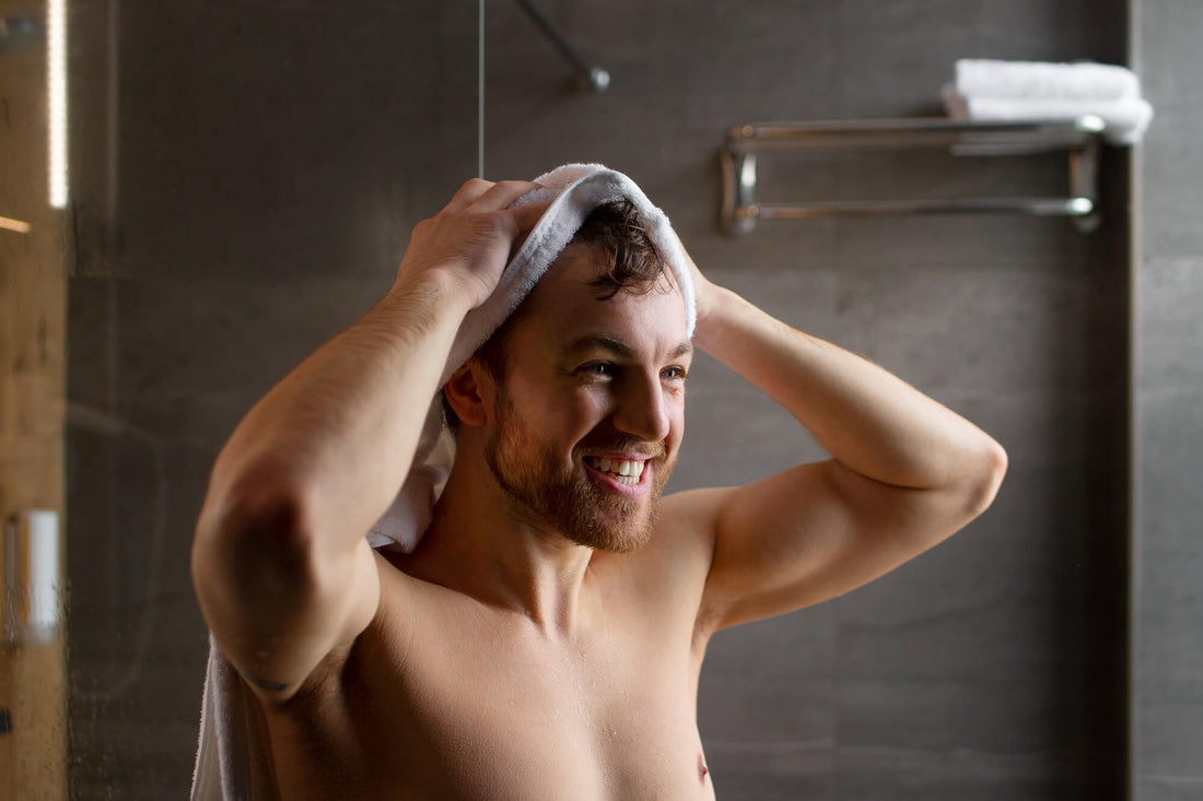 man wiping with towel