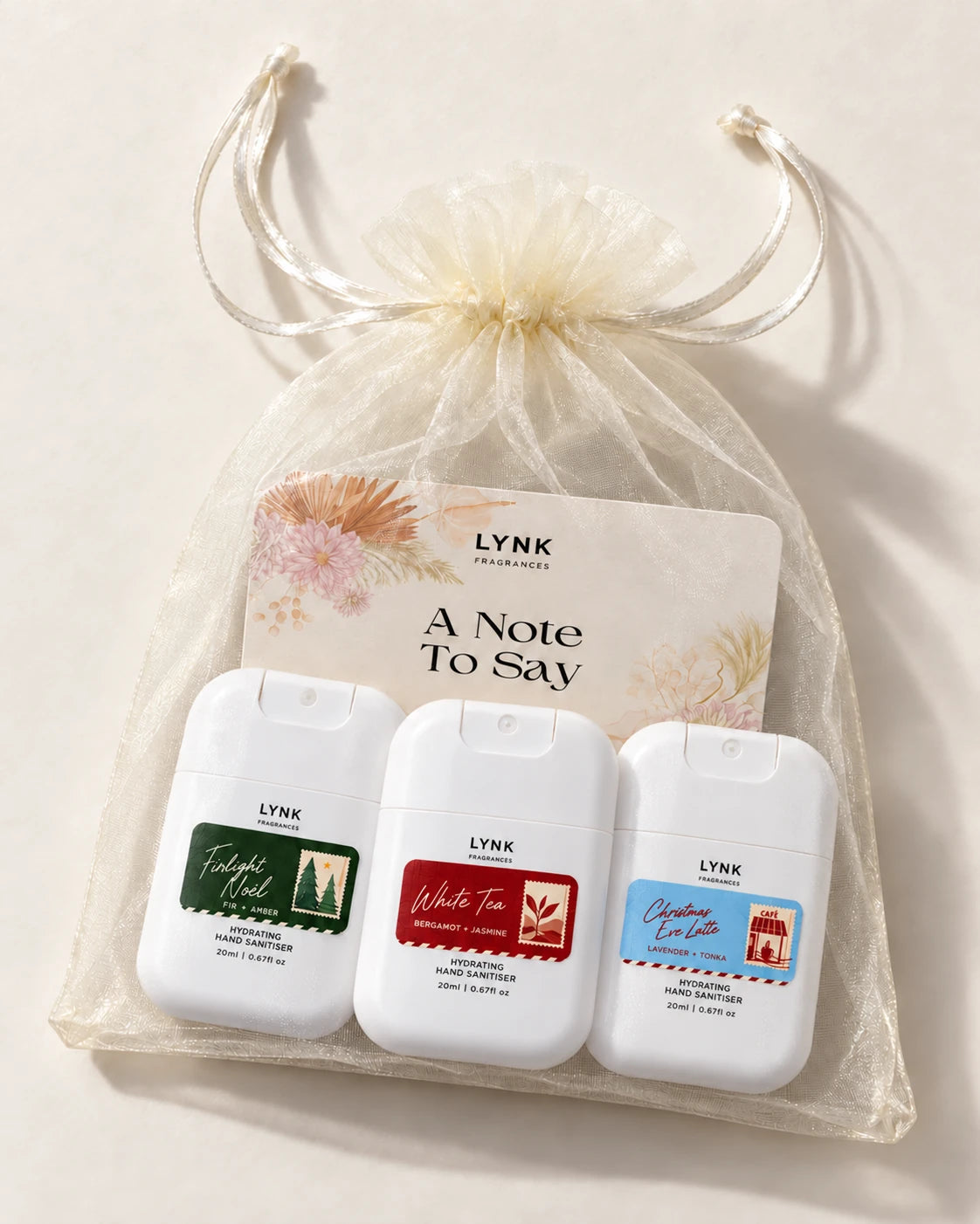 3 Christmas hand sanitisers, one of each scent
1 organza bag
1 greeting card