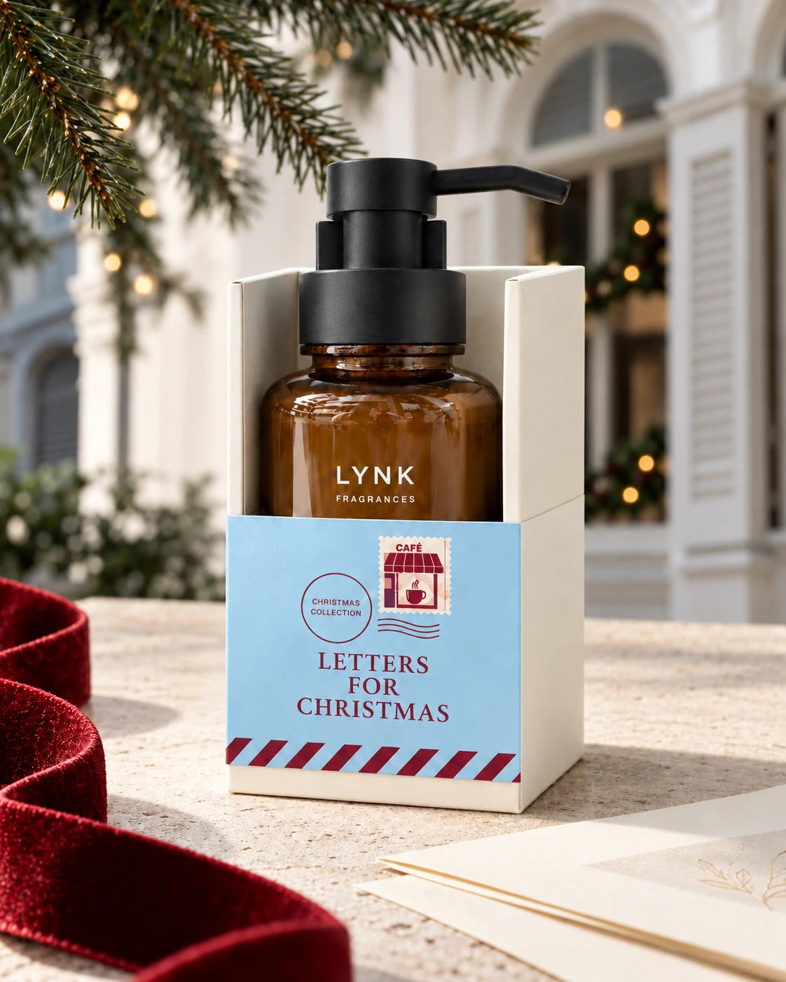 Christmas Eve Latte foaming hand wash in its blue Christmas holder, with a black pump and amber bottle.