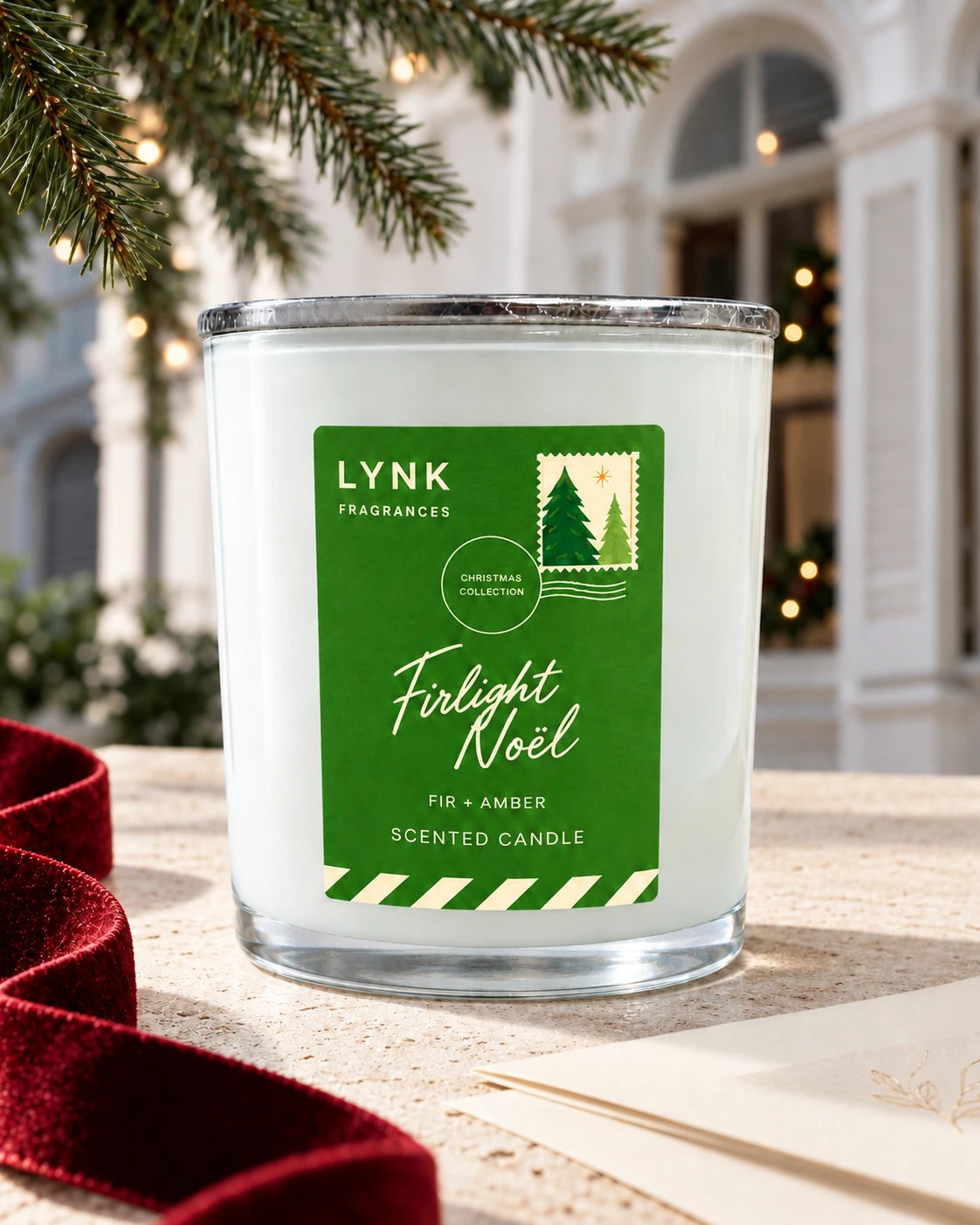 Firlight Noël scented candle in a festive Christmas still life